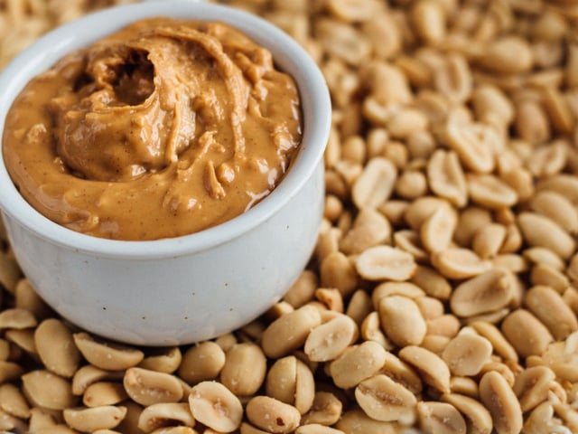 While most dogs adore peanut butter it's very important to pick a brand that doesn't contain the artiificial sweetener xylitol which is poisonous to dogs. Better yet, just make your own.