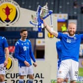 St Johnstone’s Shaun Rooney  lifts the Scottish Cup trophy after scoring the winner at Hampden. (Photo by Craig Williamson / SNS Group)