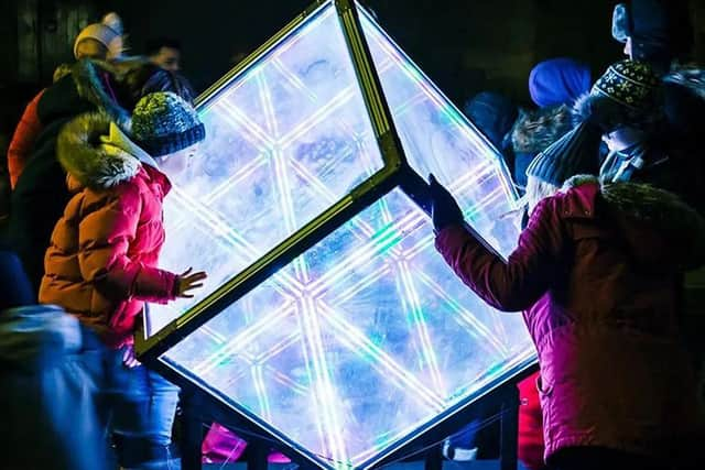 Hypercube! Created by Travelling Light Circus, the installation resembles an infinity mirror in three dimensions. Featuring over 2,500 high density, high intensity LEDs between six perfectly engineered faces of a giant cube, it can be found outside the Bon Accord Shopping Centre. PIC: James Mulkeen.