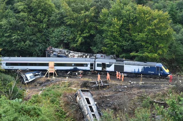 Three people died when this train derailed near Stonehaven after debris was washed on to the tracks amid heavy rain (Picture: John Devlin)