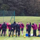 The Hearts squad will meet on Friday to discuss if they will accept the Championship trophy.