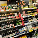 A customer looks at alcohol on the shelf at a supermarket. Picture: PA