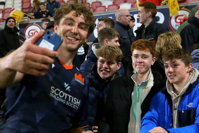 Jamie Ritchie takes a selfie with fans after Edinburgh's final game of the season, against Ulster. (Photo by Leah Scholes/INPHO/Shutterstock)