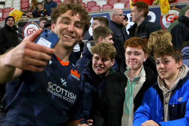 Jamie Ritchie takes a selfie with fans after Edinburgh's final game of the season, against Ulster.  (Photo by Leah Scholes/INPHO/Shutterstock)