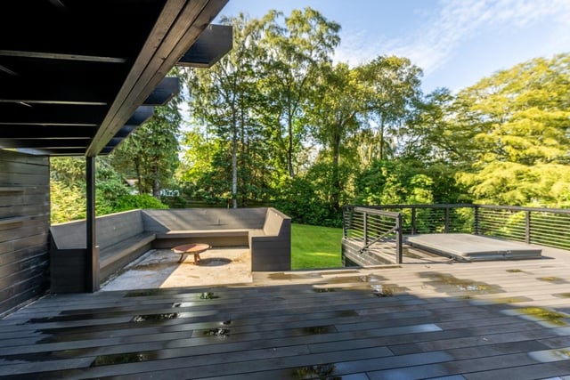 Exterior: Timber decking, with a barbecue area and hot tub, wraps attractively around the home’s kitchen-dining area, providing a fantastic space for entertaining.
Contact: Savills