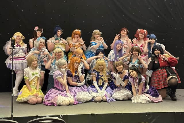 Attendees of the 2024 Cosplay Con Scotland, at the DoubleTree by Hilton hotel in Glasgow, pose for a photograph