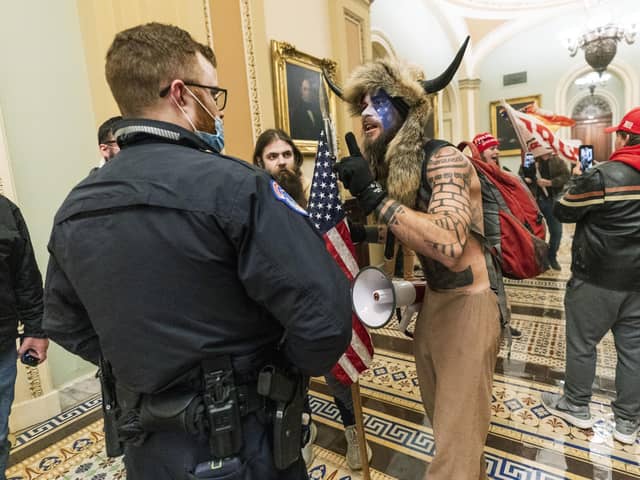 Supporters of President Donald Trump are confronted by US Capitol Police officers outside the Senate Chamber in the US Capitol (Picture: Manuel Balce Ceneta/AP)