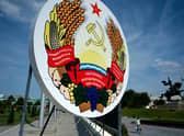 A huge coat of arms of Transnistria - Moldova's pro-Russian breakaway region on the eastern border with Ukraine, in Transnistria's capital of Tiraspol.. The breakaway region of ex-Soviet Moldova, which borders western Ukraine, saw explosions hit its security ministry on Monday and a radio tower on Tuesday morning. The incidents come after a senior Russian military official last week raised the issue of "oppression" of Russian speakers in Transnistria in the context of Russia's military campaign in Ukraine. (Photo by Sergei Gapon via Getty Images)