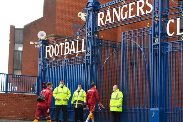 Motherwell players arrive at Ibrox.