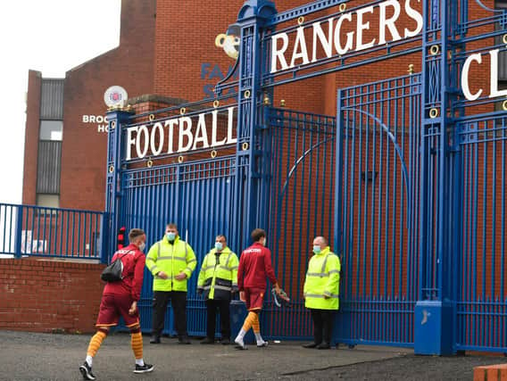 Motherwell players arrive at Ibrox.