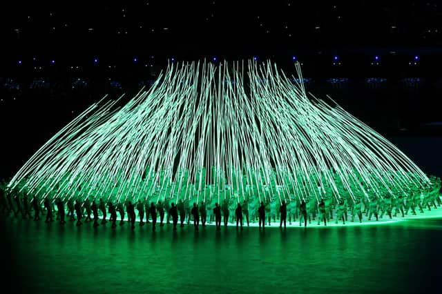 Performers create a flower display with LED lights during the Opening Ceremony of the Beijing 2022 Winter Olympics