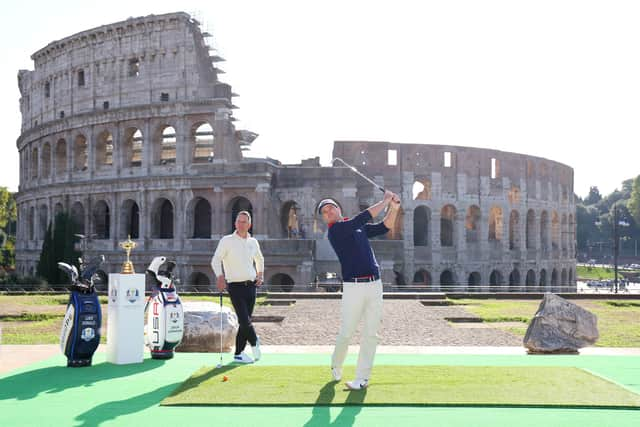 Team Captains Luke Donald of England and Zach Johnson of The United States pose for a photograph with the Ryder Cup Trophy at the Colosseum during the Ryder Cup 2023 Year to Go Media Event on October 04, 2022 in Rome.