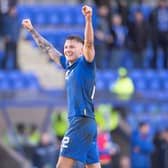 St. Johnstone's Callum Hendry celebrates towards the fans at full time after scoring a dramatic winner.  (Photo by Paul Devlin / SNS Group)