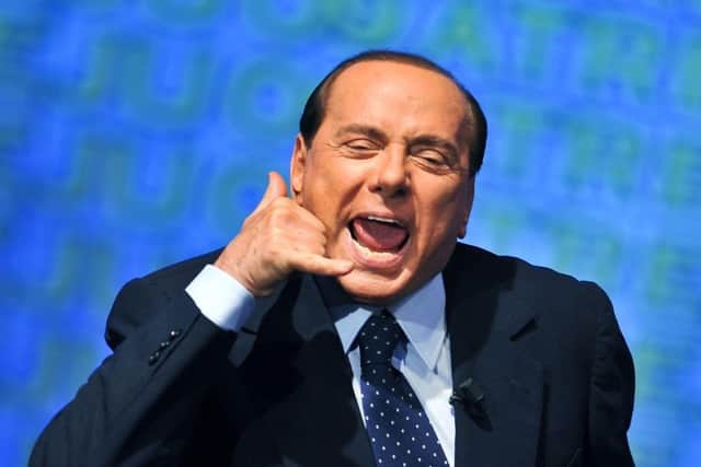 Former Italian prime minister Silvio Berlusconi gestures as he takes part at the meeting of young people of PDL (People of Freedom), in central Rome. Picture: Andreas Solaro/AFP via Getty Images