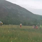 Air ambulance arrives at the scene after boy reportedly burns his feet on burning embers at a fire near St Mary's Loch in Selkirk picture: E Mihaes