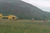 Air ambulance arrives at the scene after boy reportedly burns his feet on burning embers at a fire near St Mary's Loch in Selkirk picture: E Mihaes