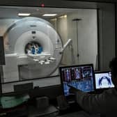 A radiologist supervises a patient undergoing a MRI. Picture: STEPHANE DE SAKUTIN/AFP via Getty Images