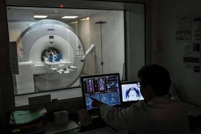 A radiologist supervises a patient undergoing a MRI. Picture: STEPHANE DE SAKUTIN/AFP via Getty Images
