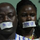 Activists demanding that rich countries pay up for climate finance for developing countries of the Global South protest at COP29 (Picture: Sean Gallup/Getty Images)