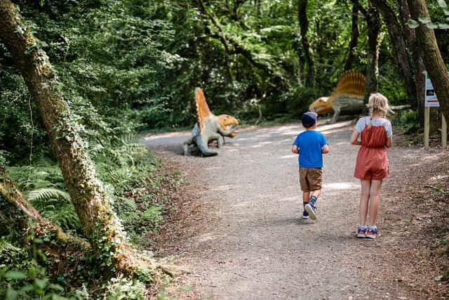 Children follow The Dinosaur Trail at the Dinosaur Park, Tenby, Wales. PIc: o&c photography