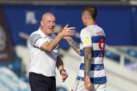 Queens Park Rangers' Lyndon Dykes with manager Mark Warburton during the Sky Bet Championship match at The Kiyan Prince Foundation Stadium, London. Photo: Bradley Collyer/PA Wire.