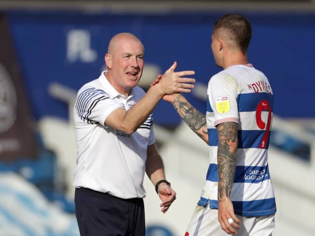 Queens Park Rangers' Lyndon Dykes with manager Mark Warburton during the Sky Bet Championship match at The Kiyan Prince Foundation Stadium, London. Photo: Bradley Collyer/PA Wire.