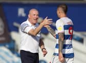 Queens Park Rangers' Lyndon Dykes with manager Mark Warburton during the Sky Bet Championship match at The Kiyan Prince Foundation Stadium, London. Photo: Bradley Collyer/PA Wire.