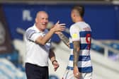 Queens Park Rangers' Lyndon Dykes with manager Mark Warburton during the Sky Bet Championship match at The Kiyan Prince Foundation Stadium, London. Photo: Bradley Collyer/PA Wire.