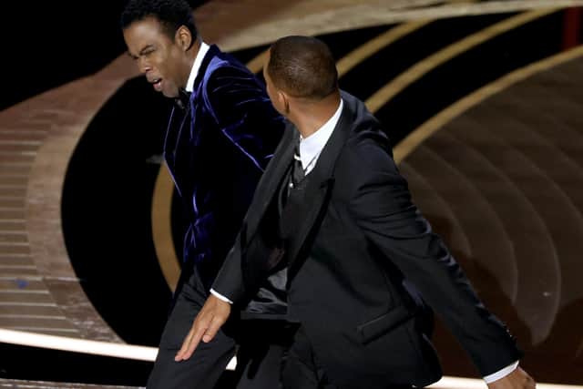 Will Smith slaps Chris Rock onstage during the 94th Annual Academy Awards at Dolby Theatre on March 27, 2022