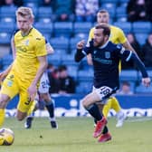 Hibs' Josh Doig and Dundee's Paul McMullan tussle during Tuesday night's match at Dens Park.