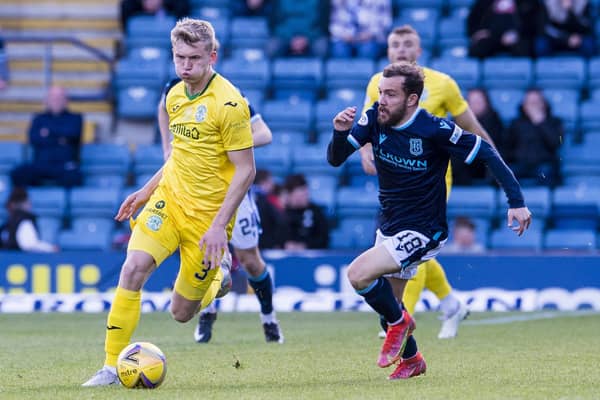 Hibs' Josh Doig and Dundee's Paul McMullan tussle during Tuesday night's match at Dens Park.