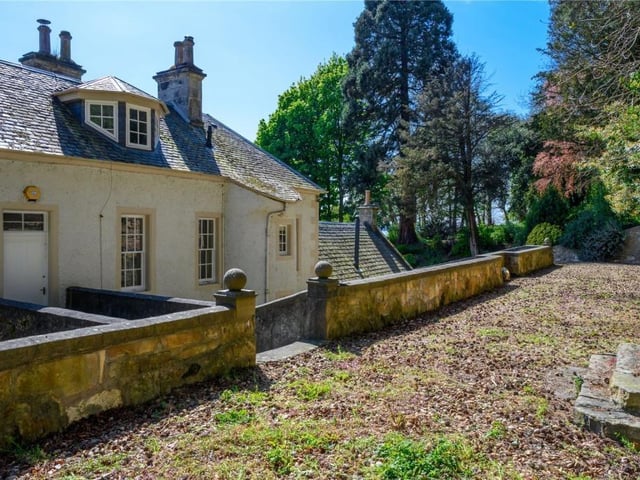 Rear of property showing walkway and bridge to first floor entrance.