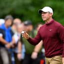 Rory McIlroy acknowledges the crowd on the 14th green during day four of the BMW PGA Championship at Wentworth Club. PIcture: Ross Kinnaird/Getty Images.