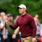 Rory McIlroy acknowledges the crowd on the 14th green during day four of the BMW PGA Championship at Wentworth Club. PIcture: Ross Kinnaird/Getty Images.