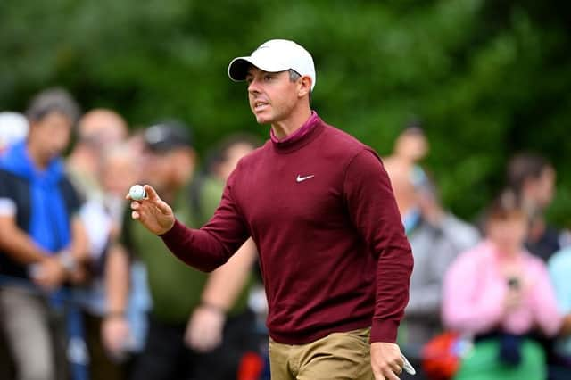 Rory McIlroy acknowledges the crowd on the 14th green during day four of the BMW PGA Championship at Wentworth Club. PIcture: Ross Kinnaird/Getty Images.