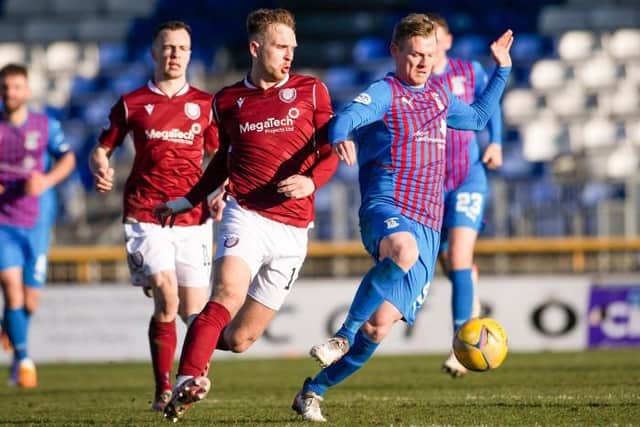 Arbroath's Chris Hamilton (L) challenges Inverness' Billy McKay (r) during a cinch Championship match between Inverness Caledonian Thistle and Arbroath at the Caledonian Stadium, on March 12, 2022, in Inverness, Scotland. (Photo by Paul Devlin / SNS Group)