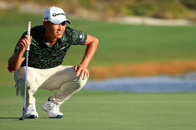 Collin Morikawa of the United States lines up a putt on the 18th hole during the final round of the Hero World Challenge at Albany Golf Course.