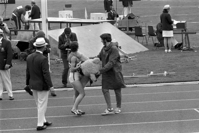 An unidentified female athlete with Dunky Dick, the Games mascot, on the last day of the 1970 Commonwealth Games in Edinburgh.