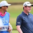Bob MacIntyre with his caddie Mikey Thomson during a practice round on the Old Course at St Andrews ahead of the 150th Open. Picture: Ian Rutherford/Alamy Live News.
