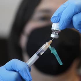 A registered nurse prepares a dose of a monkeypox vaccine. Picture: AP Photo/Rick Bowmer