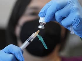 A registered nurse prepares a dose of a monkeypox vaccine. Picture: AP Photo/Rick Bowmer