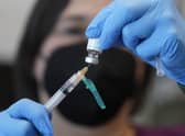 A registered nurse prepares a dose of a monkeypox vaccine. Picture: AP Photo/Rick Bowmer