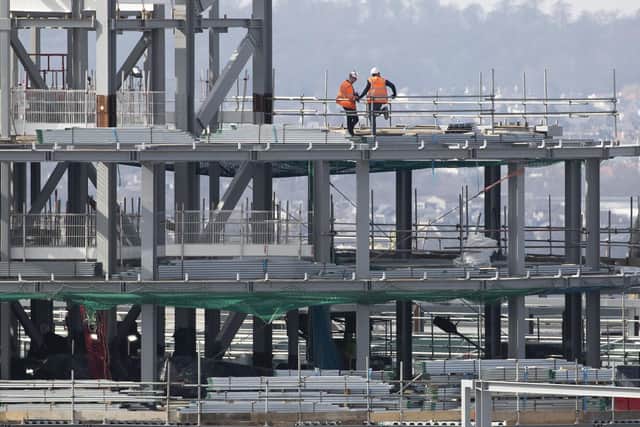 Experts say Britain’s construction sector is still busy and new orders continue to roll in, but it is losing momentum. Picture: Jane Barlow/PA Wire