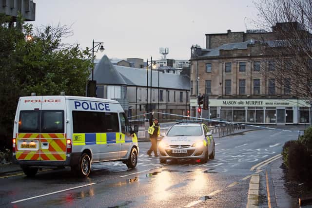 A police presence at Green Street in Kilmarnock, where officers continue to investigate what Police Scotland describe as a "serious incident" in the grounds of a local hospital and another location in the area. Picture date: Friday February 5, 2021. PA Photo. Police said the incidents are not being treated as terrorist-related but are potentially linked. See PA story POLICE Hospital. Photo credit should read: Jane Barlow/PA Wire