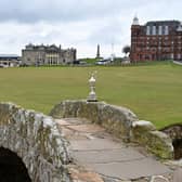 The Claret Jug, the trophy for the Champion Golfer of the Year, is pictured on the Swilcan Bridge, during a preview ahead of the 150th British Open Golf Championship at The Old Course at St Andrews. Picture: Glyn Kirk/AFP via Getty Images