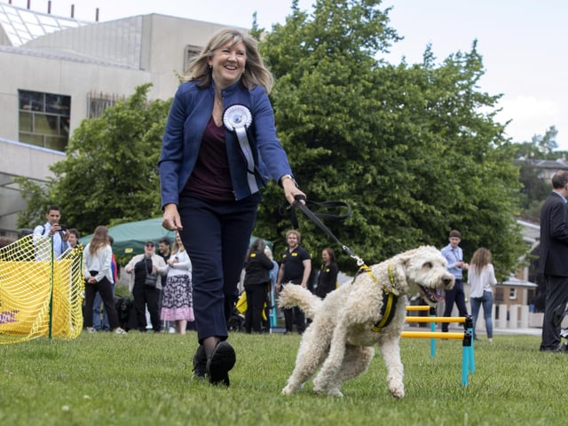 Presiding Officer Alison Johnstone with Oakley from Dogs Trust as they take on the assault course at the fifth Holyrood Dog of the Year competition, run by The Kennel Club and Dogs Trust. Picture: Katielee Arrowsmith/SWNS