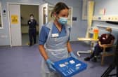 Deputy charge nurse Katie McIntosh arrives to administer the first of two Pfizer/BioNTech Covid-19 vaccine jabs to staff at the Western General Hospital, in Edinburgh, on Tuesday.