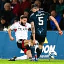 Aberdeen captain Graeme Shinnie received a red card for this late challenge on Jack Baldwin following a VAR check in the 1-0 win over Ross County.  (Photo by Mark Scates / SNS Group)