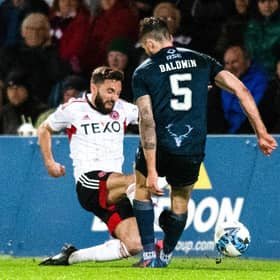 Aberdeen captain Graeme Shinnie received a red card for this late challenge on Jack Baldwin following a VAR check in the 1-0 win over Ross County.  (Photo by Mark Scates / SNS Group)