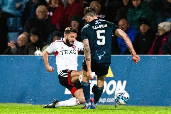 Aberdeen captain Graeme Shinnie received a red card for this late challenge on Jack Baldwin following a VAR check in the 1-0 win over Ross County.  (Photo by Mark Scates / SNS Group)